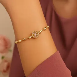 PULSEIRA ESFERA VAZADA E MINI ESFERA FOLHEADA EM OURO 18K
