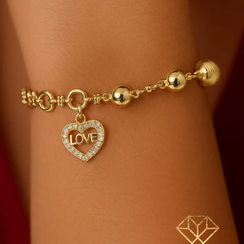 PULSEIRA EM ESFERAS COM PINGENTE CORAÇÃO LOVE  BANHADA EM OURO 18K